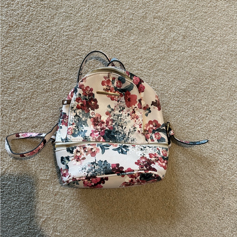 Cute flower purse backpack.
